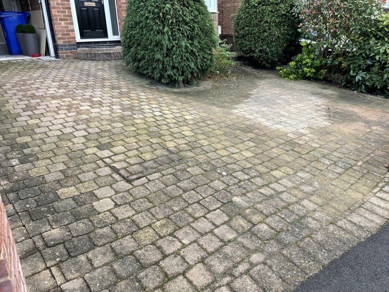 Block paving driveway in Ilkeston before being pressure washed: Swipe To View More Images