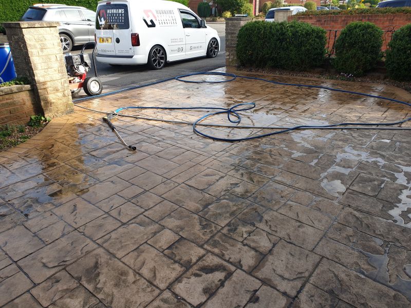 Pattern imprinted concrete before being cleaned and resealed in Arnold Nottingham : Swipe To View More Images