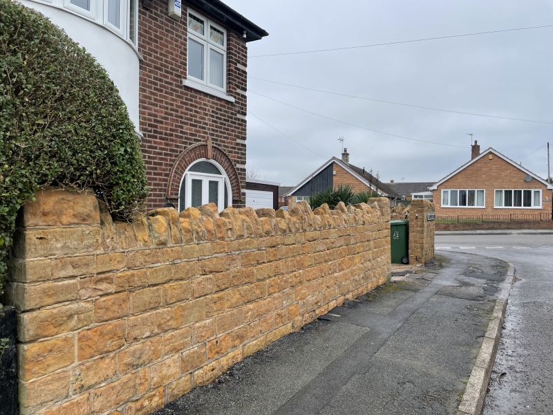 Stone wall in Langley mill&comma; Derbyshire after being cleaned : Swipe To View More Images